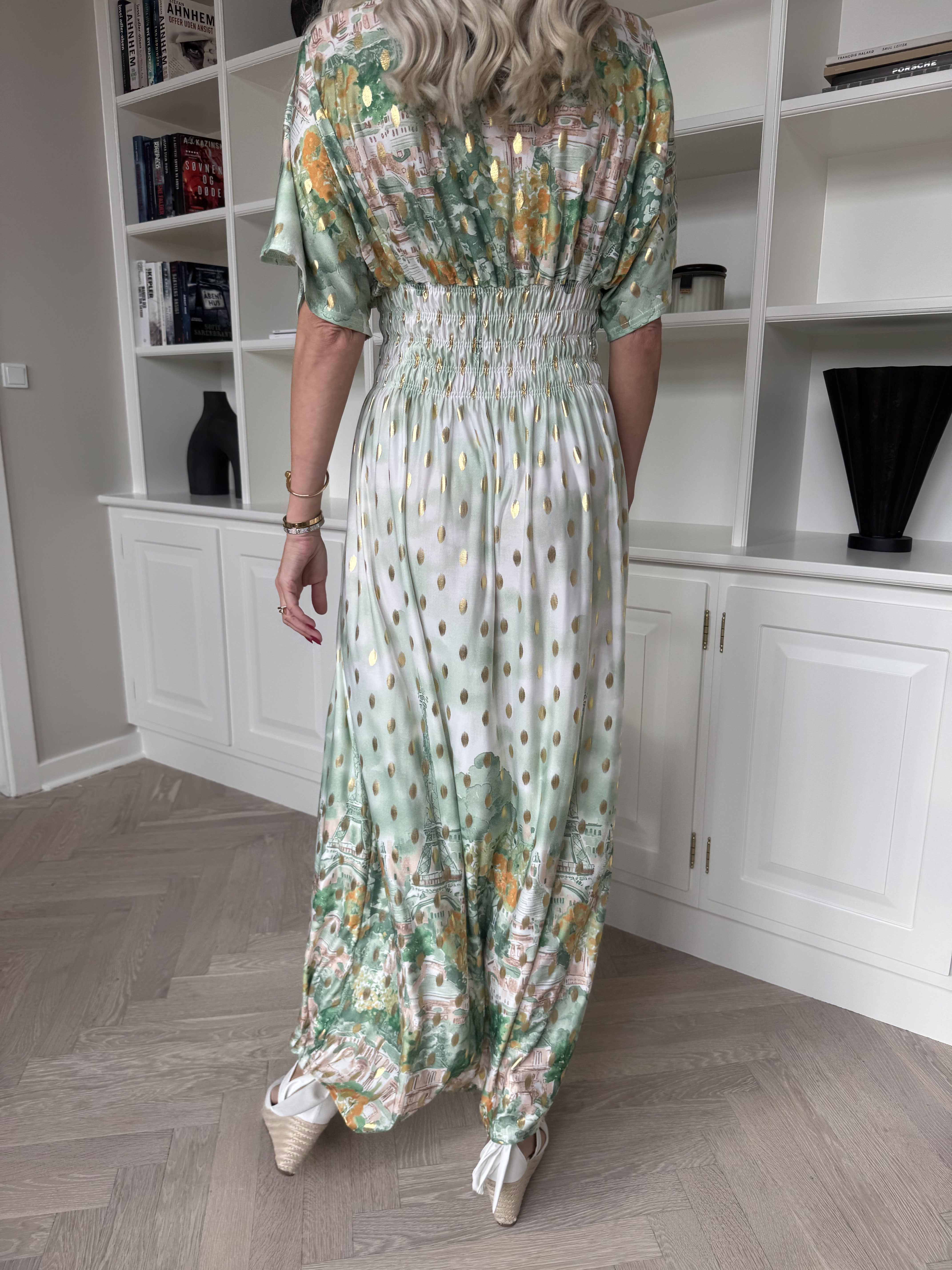 Pams Paris - Lång elastisk mönstrad klänning med guldnitar